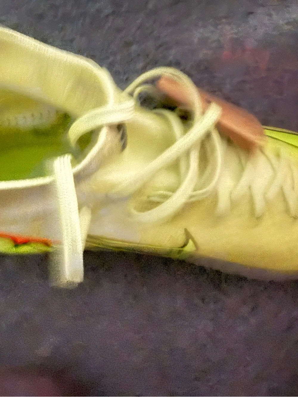 Nike Kids Soccer Cleats in Neon Yellow with Orange Accents